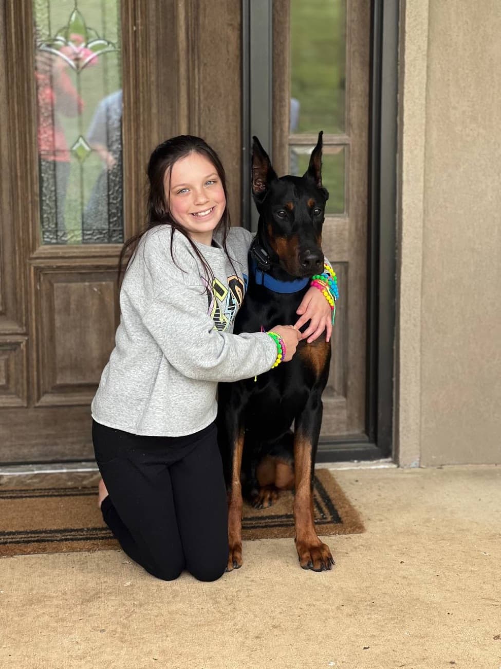 A High Point family at home with their Doberman